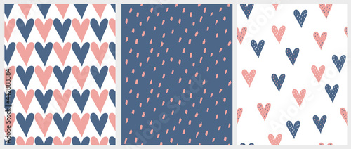 Cute Hand Drawn Romantic Seamless Vector Patterns. Blue and Pink Hearts Isolated on a White Background. Simple Infantile Style Geometric Print with Irregular Spots on a Dark Blue Backdrop.