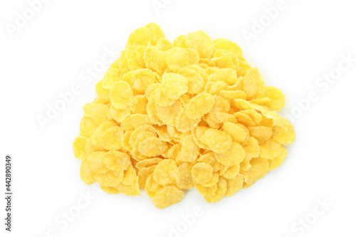 Dry uncooked corn flakes isolated on white background