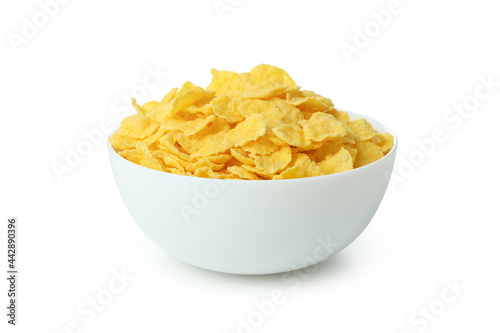 Plate of dry uncooked corn flakes isolated on white background