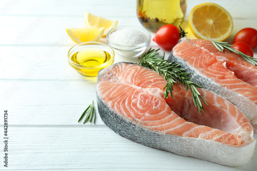 Concept of cooking salmon on white wooden table Concept of cooking salmon on white wooden table
