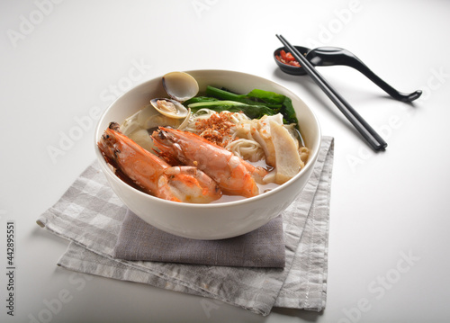 big tiger prawn seafood Lala with bee hoon noodle mee soup hot asian menu in bowl  photo