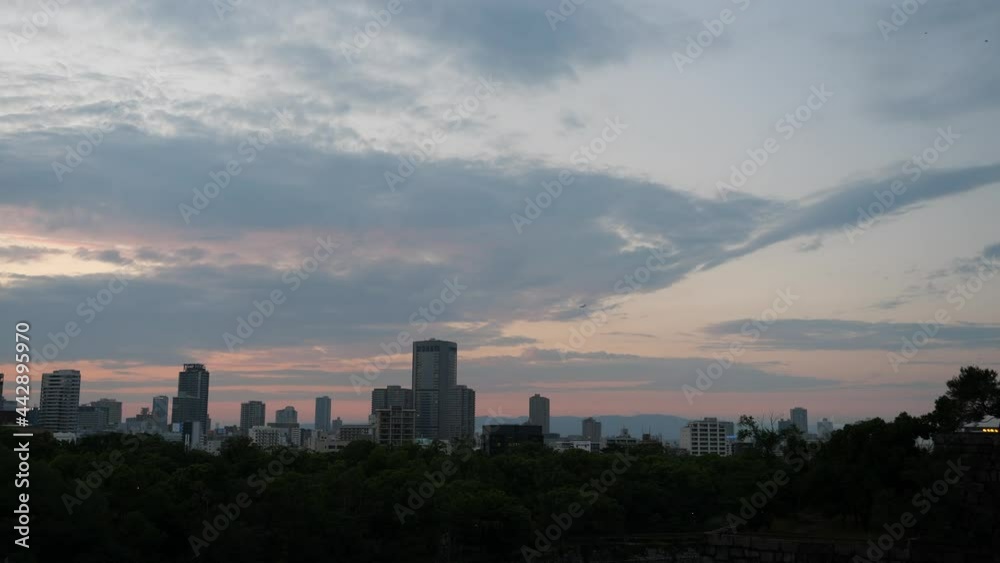 Osaka city at the evening , City view with beautiful twilight sky , panning shot Osaka city at the evening , City view with beautiful twilight sky , panning shot