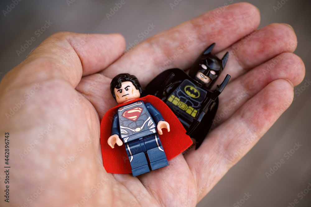 Tambov, Russian Federation - May 28, 2021 Lego Superman and Batman  minifigures in person hand. Focus on Superman. Stock Photo | Adobe Stock