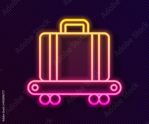 Glowing neon line Airport conveyor belt with passenger luggage, suitcase, bag, baggage icon isolated on black background. Vector