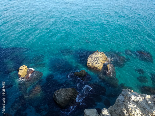 view of the rocks in a calm sea.