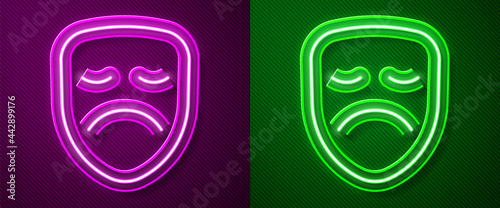 Glowing neon line Drama theatrical mask icon isolated on purple and green background. Vector