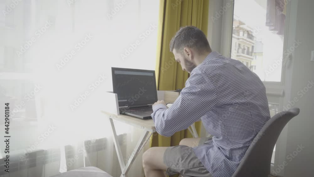 Businessman trader investor analyst looking at financial market charts Businessman trader investor analyst looking at financial market charts
