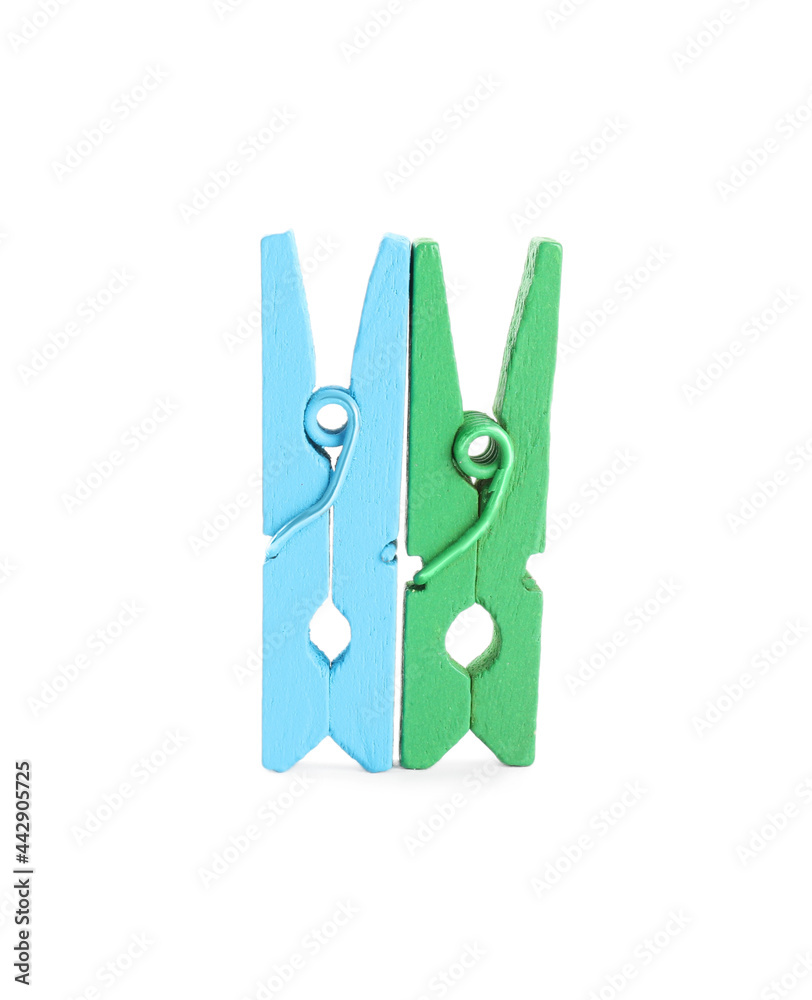 Two colorful wooden clothespins on white background Two colorful wooden clothespins on white background