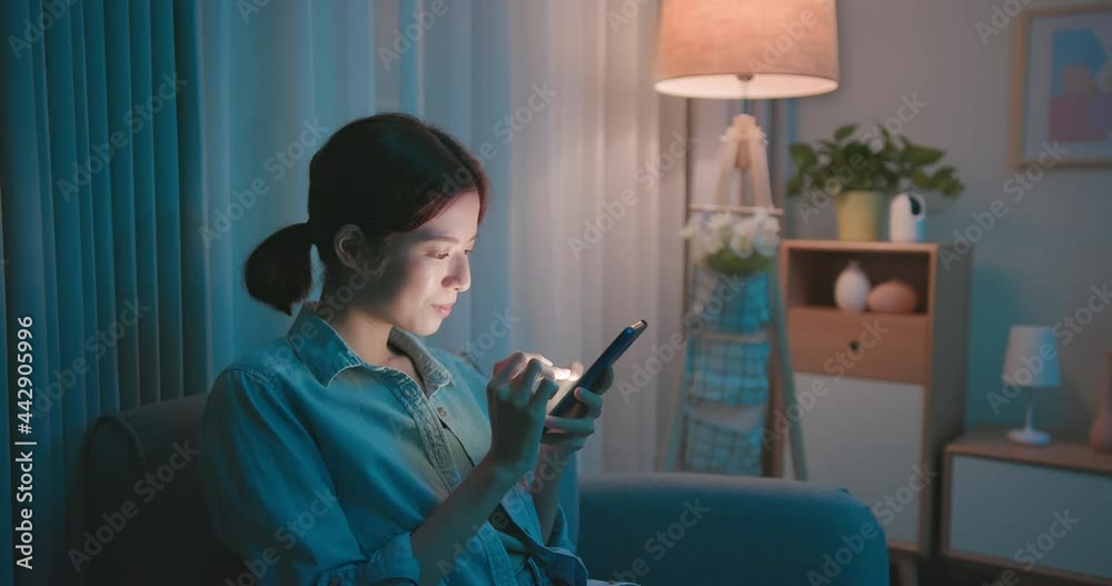 woman using phone at night