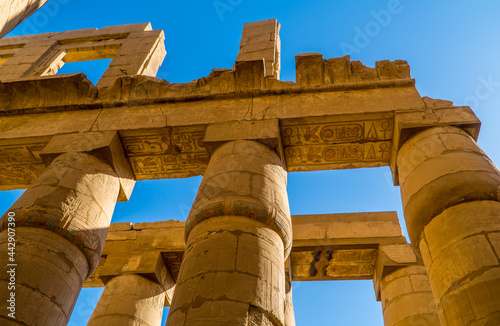 Columns with hieroglyphics and ancient Egyptian ruins in the temple of Karnak, Luxor