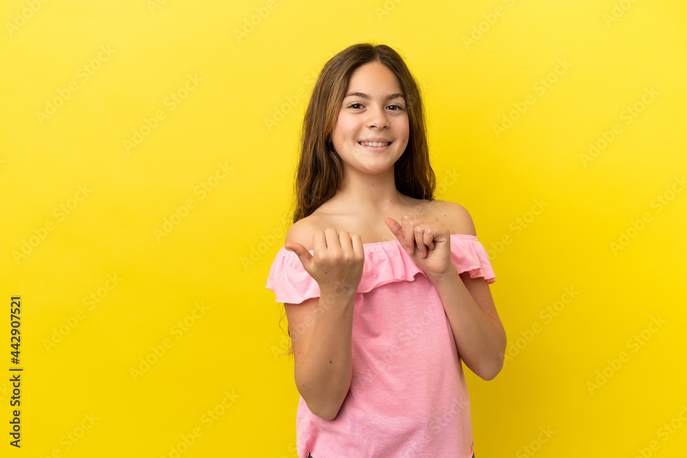 Little caucasian girl isolated on yellow background pointing to the side to present a product Little caucasian girl isolated on yellow background pointing to the side to present a product