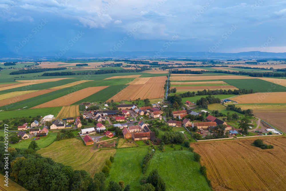 Storm in the countryside. Village from drone aerial view. Beautiful village with houses and fields in Nysa, Poland. Polish farmland