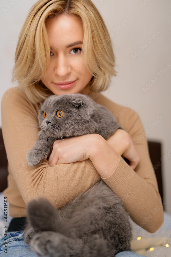 Pets, morning, comfort, rest and people concept - happy young woman with cat in bed at home Pets, morning, comfort, rest and people concept - happy young woman with cat in bed at home