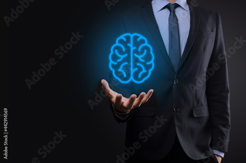 Businessman holding abstract brain and icon tools  device  customer network connection communication on virtual   innovative development future technology  science  innovation and business concept