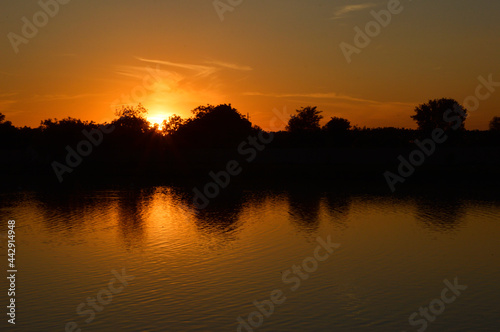 sunset reflected in the cam water © Jana