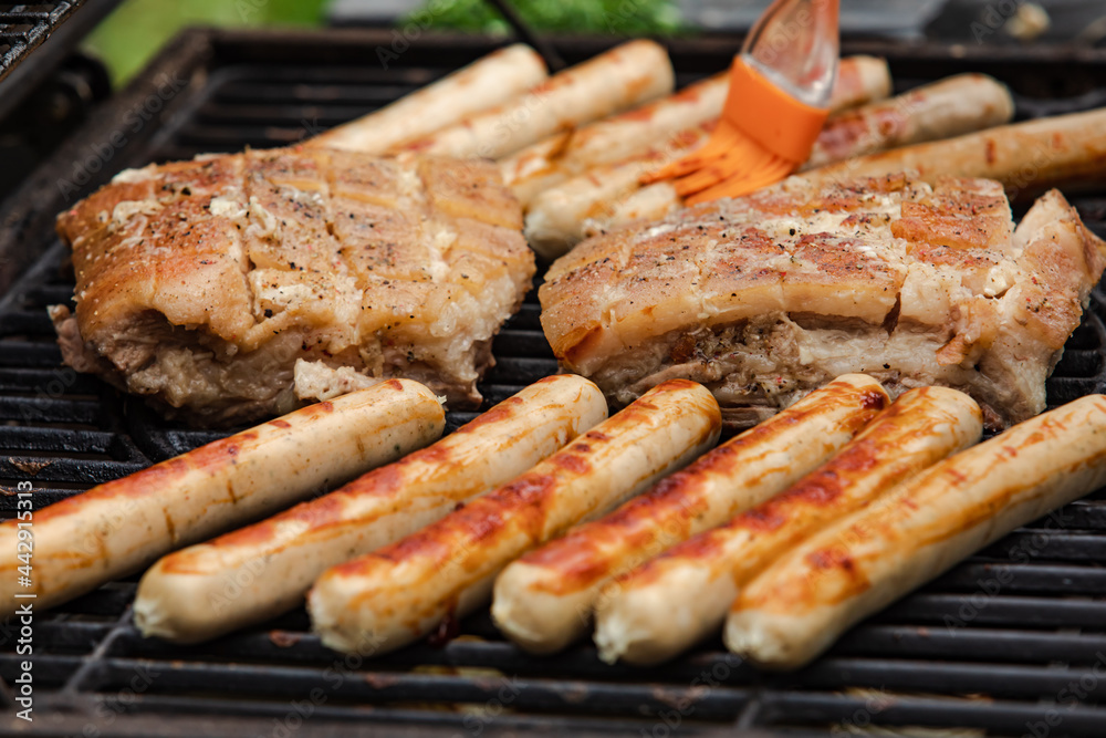 Delicious fresh sausages and grilled pork outdoors