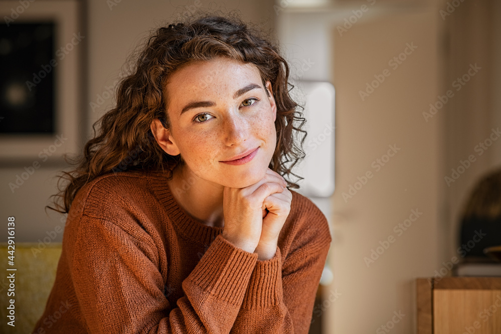 Fototapeta premium Serene young woman looking at camera
