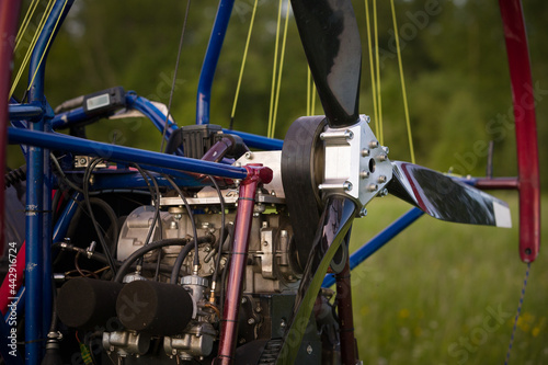 Closeup of a parajet cart with a no-spin engine and a propeller for two people on the take-off field. Extreme sports. Paragliding and small aircraft.