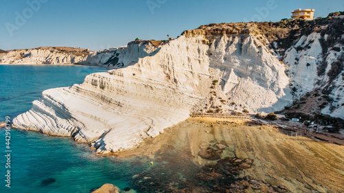 Scala dei Turchi,Sicily,Italy.Aerial view of white rocky cliffs,turquoise clear water.Sicilian seaside tourism,popular tourist attraction.Limestone rock formation on coast.Travel holiday scenery #442916799