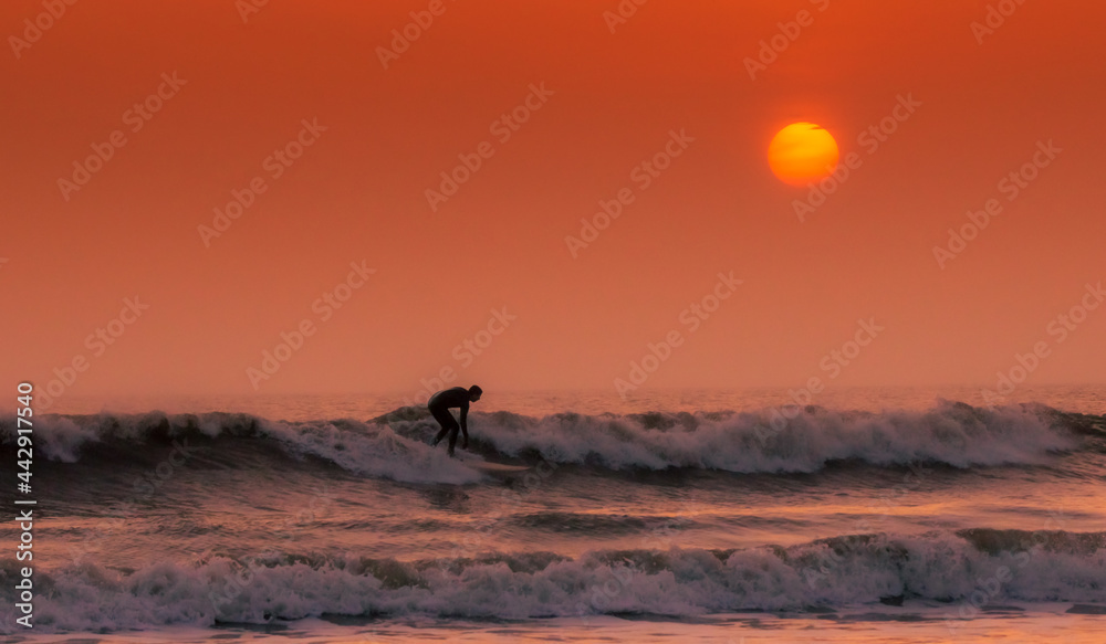 Surfer at dusk