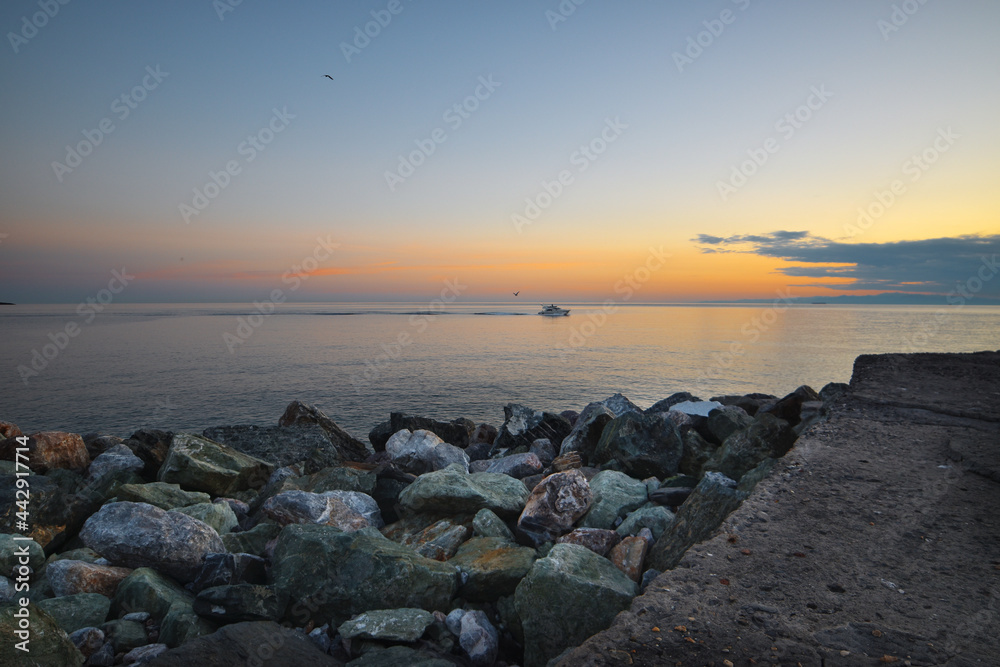 wonderful sunset over the sea in Camogli, colorful rocks frame this glimpse of paradise wonderful sunset over the sea in Camogli, colorful rocks frame this glimpse of paradise