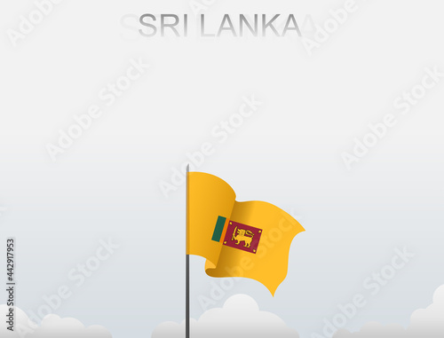 Srilanka flag flutters on a pole standing tall under a white sky