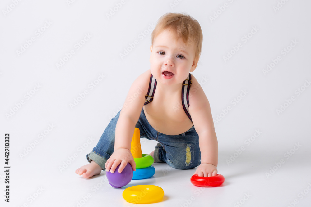 toddler baby boy with toy on white background toddler baby boy with toy on white background
