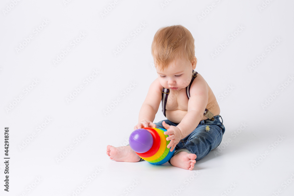 toddler baby boy with toy on white background toddler baby boy with toy on white background
