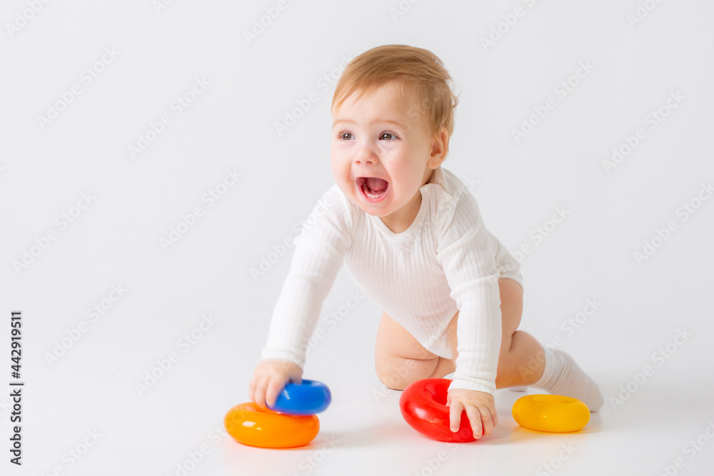 toddler boy with toy on white background