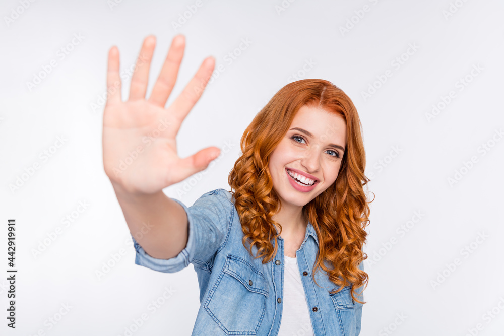 Photo of attractive young happy pretty woman hold hand give you high five isolated on grey color background Photo of attractive young happy pretty woman hold hand give you high five isolated on grey color background