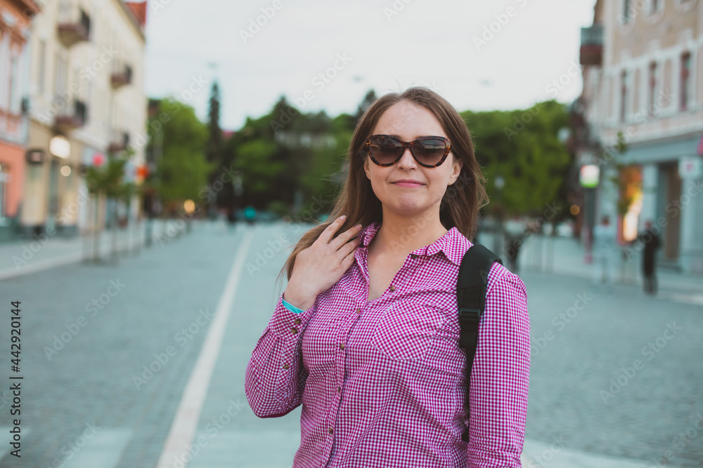 Girl travelling alone around old european cities