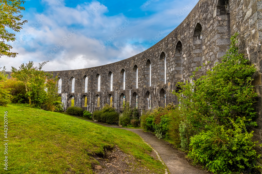 A view along the sea facing walls of the tower above the town of Oban, Scotland on a summers day