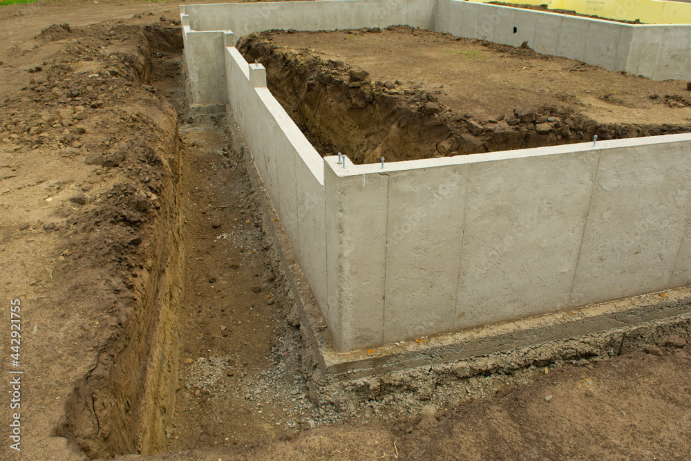 Concrete footings and basement walls complete and ready for the next phase of construction process. Concrete footings and basement walls complete and ready for the next phase of construction process.