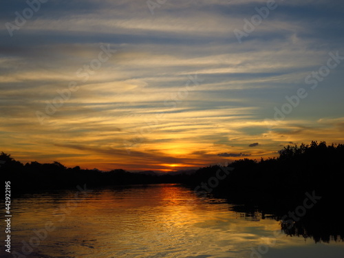 Magnificent sunset on a river with a colorful sky.