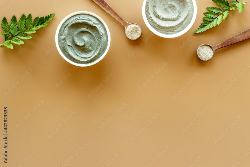 Blue clay cosmetic powder and mask in bowls. Top view Blue clay cosmetic powder and mask in bowls. Top view