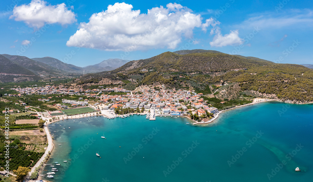 Aerial, drone panoramic view of Ancient Epidaurus town beach and marine at Peloponnese, Greece.