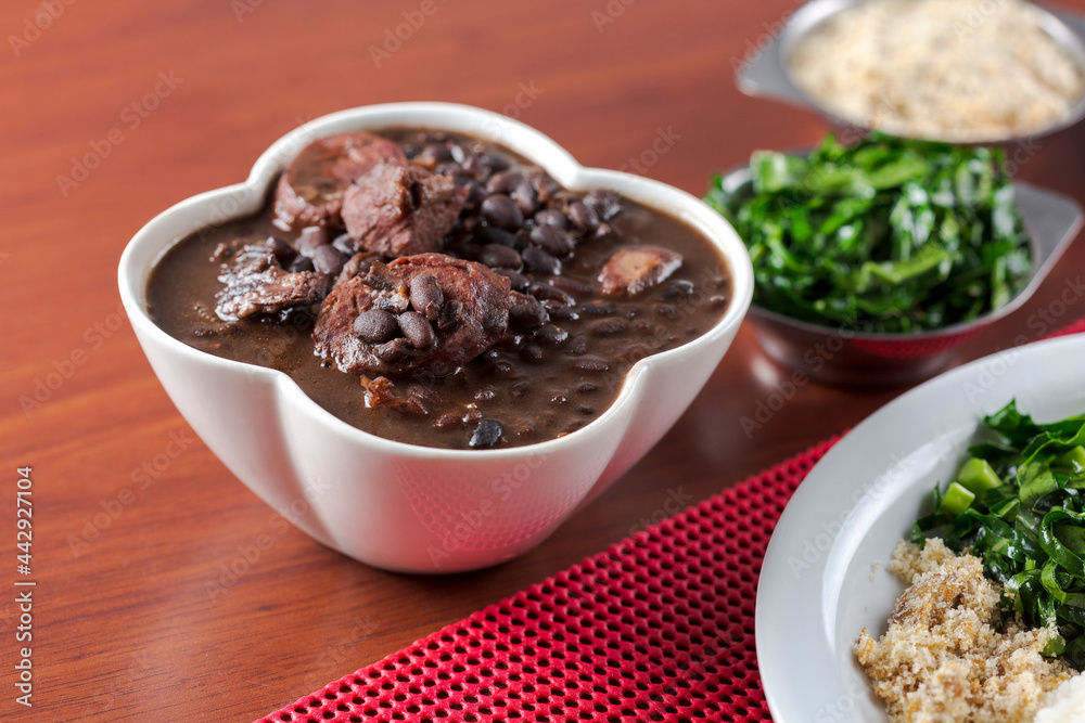 Container with traditional Brazilian feijoada food Container with traditional Brazilian feijoada food