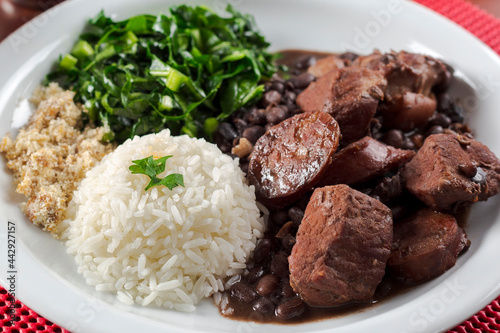Bild auf Leinwand Dish with traditional Brazilian feijoada up close