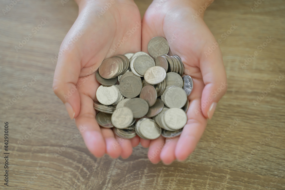 Woman hand money and giveing donate charity.raise donation concept Woman hand money and giveing donate charity.raise donation concept