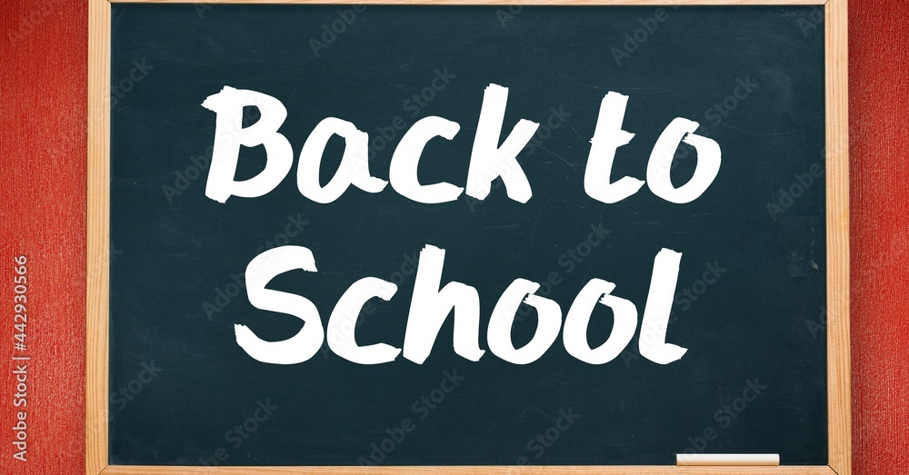 Obraz premium Composition of back to school text over black chalkboard