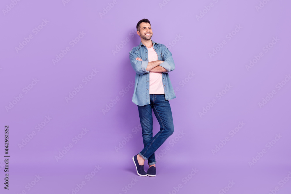 Full length body size photo man smiling confident crossed hands dreamy isolated pastel violet color background Full length body size photo man smiling confident crossed hands dreamy isolated pastel violet color background