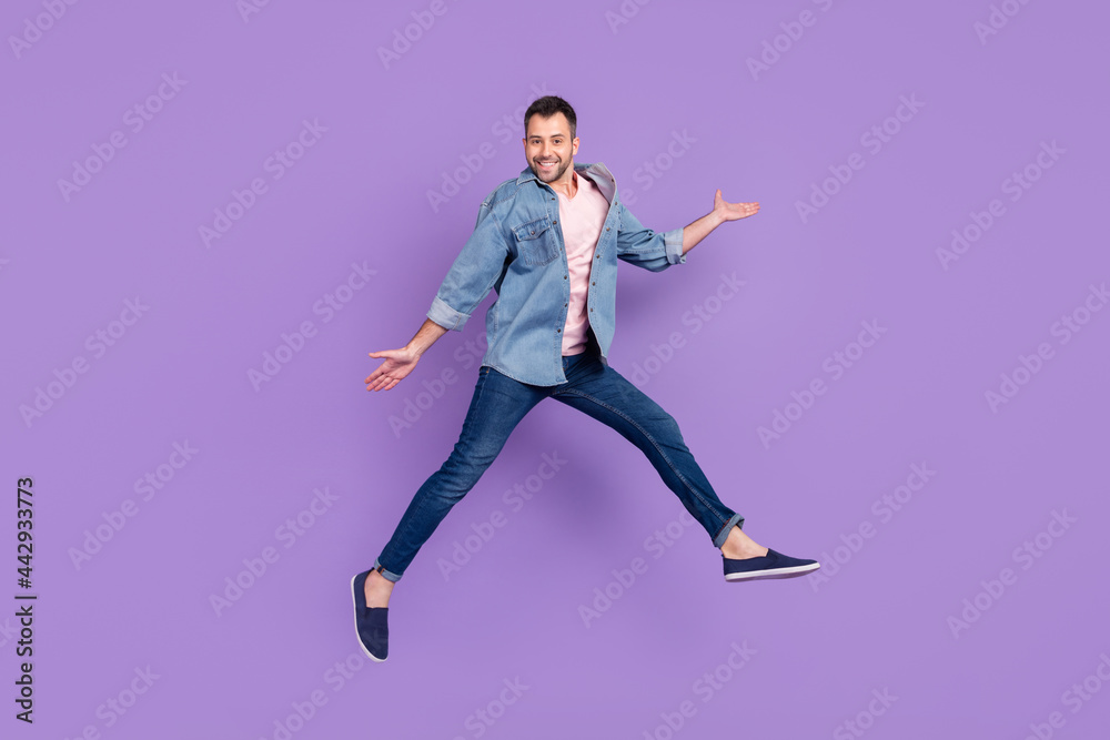 Full length body size photo man smiling jumping high cheerful funky isolated pastel violet color background
