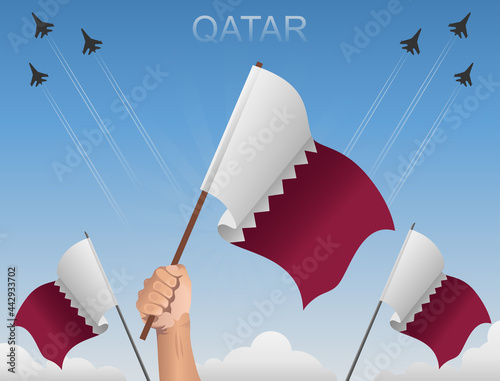 Qatar flags flying under the blue sky 