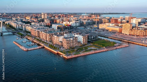 Aerial hyperlapse of the embankment in the Jatkasaari neighborhood on the sunset, Helsinki, Finland. Modern Nordic Architecture. Jatkasaari neighborhood is a redevelopment of the old port area.