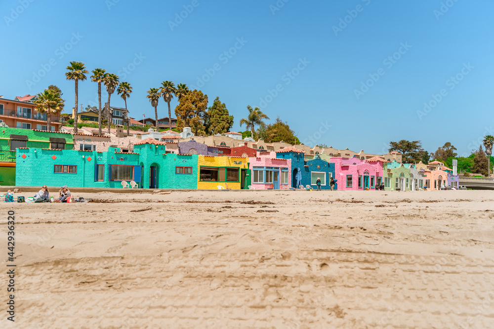 Colored houses near the coast in the city of Capitola. Summer day by the ocean. Capitola, USA - 19 Apr 2021 Colored houses near the coast in the city of Capitola. Summer day by the ocean. Capitola, USA - 19 Apr 2021