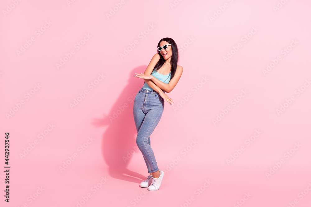 Full length body size photo woman in sunglass dancing relaxing on holidays isolated pastel pink color background