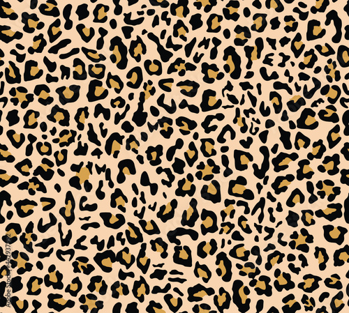 Fototapeta Vector leopard print, seamless trendy background. Yellow pattern for textiles. Animal skin