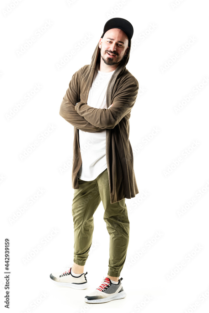 Confident happy young stylish trendy hipster man in cardigan with crossed arms smiling. Full body portrait isolated on white background Confident happy young stylish trendy hipster man in cardigan with crossed arms smiling. Full body portrait isolated on white background