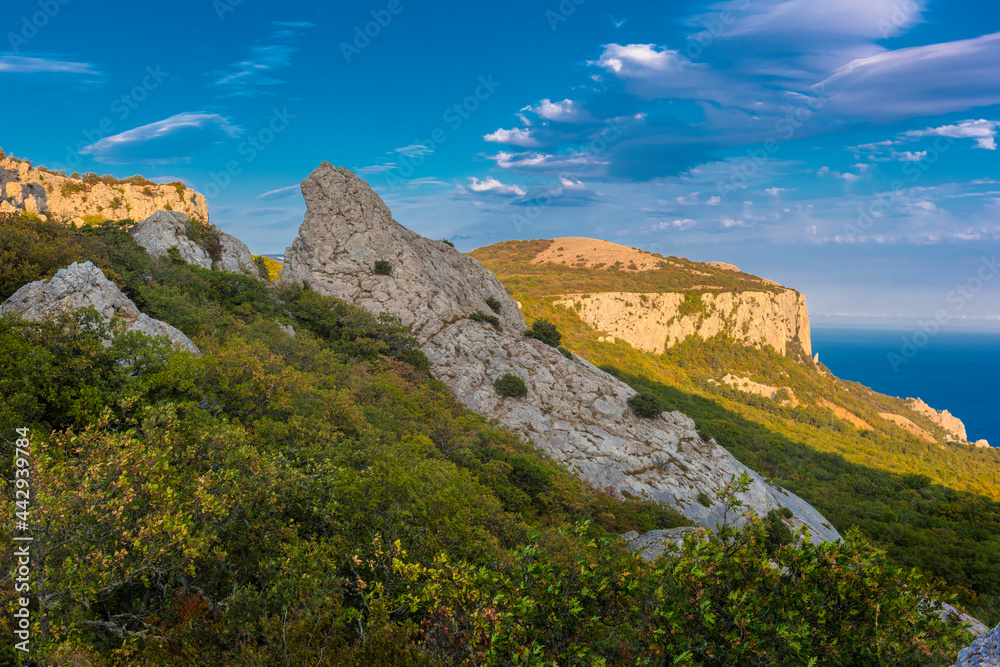 Temple of the Sun - rocks surrounded by forest in the mountains of Crimea,