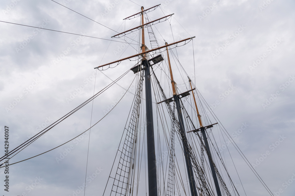 Details of mast and rigging on tall ship moored in Toronto's  Inner Harbour, shot on a summer morning.